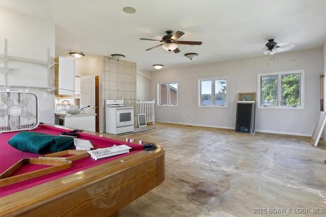 29773 Hemlock Rd, Gravois Mills, MO 65037 - kitchen featuring white stove, a ceiling fan, concrete flooring, and billiards