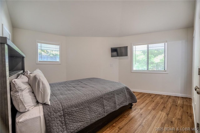 172 Kansas City Way, Sunrise Beach, MO 65079 - bedroom featuring wood finished floors and baseboards