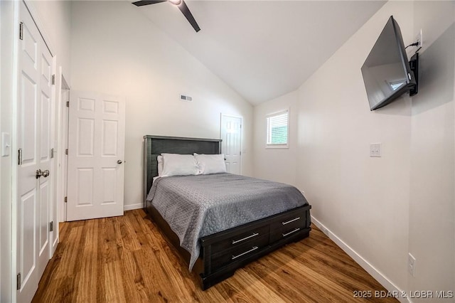 172 Kansas City Way, Sunrise Beach, MO 65079 - bedroom featuring vaulted ceiling and dark wood-type flooring