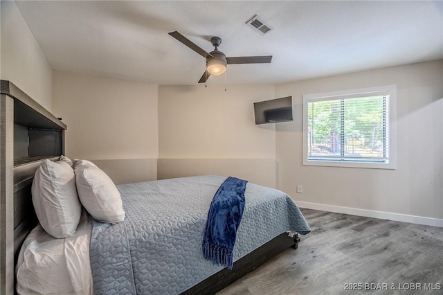 172 Kansas City Way, Sunrise Beach, MO 65079 - bedroom featuring wood finished floors and ceiling fan