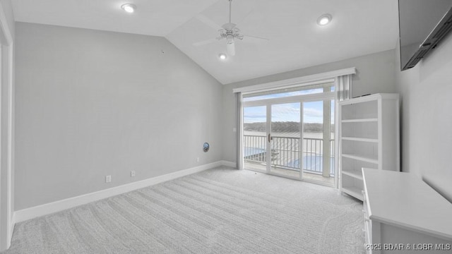 5450 Christopher Dr Unit 243, Osage Beach, MO 65065 - empty room with carpet flooring, a water view, vaulted ceiling, ceiling fan, and recessed lighting