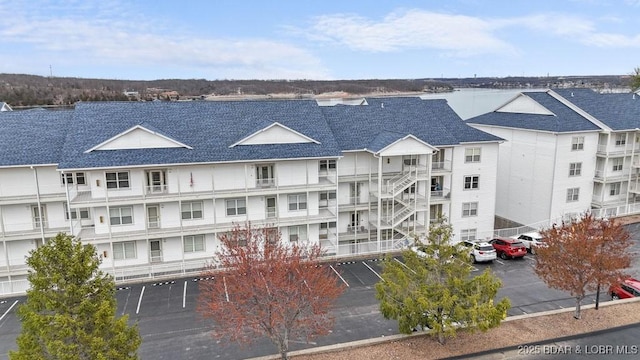 5450 Christopher Dr Unit 243, Osage Beach, MO 65065 - view of apartment building / complex featuring uncovered parking