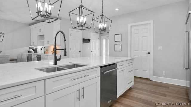5450 Christopher Dr Unit 243, Osage Beach, MO 65065 - kitchen with a chandelier, stainless steel dishwasher, white cabinetry, dark wood-type flooring, and recessed lighting