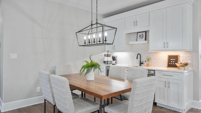 5450 Christopher Dr Unit 243, Osage Beach, MO 65065 - dining room with dark wood finished floors and a chandelier