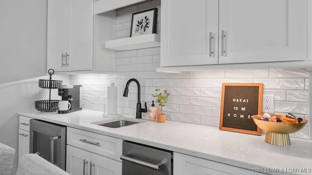 5450 Christopher Dr Unit 243, Osage Beach, MO 65065 - kitchen with wine cooler, white cabinetry, backsplash, and light stone countertops