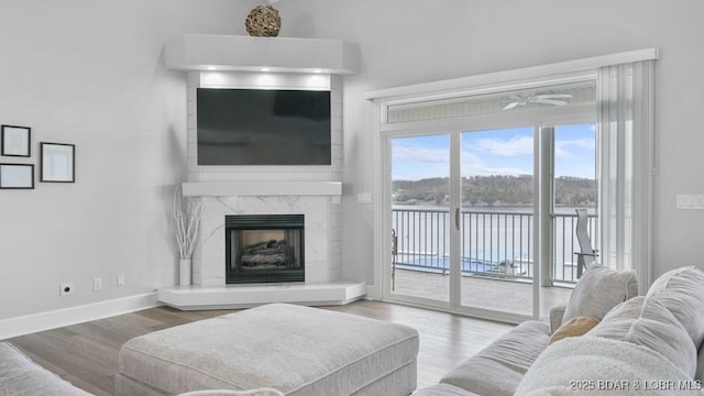 5450 Christopher Dr Unit 243, Osage Beach, MO 65065 - living room with wood finished floors and a high end fireplace