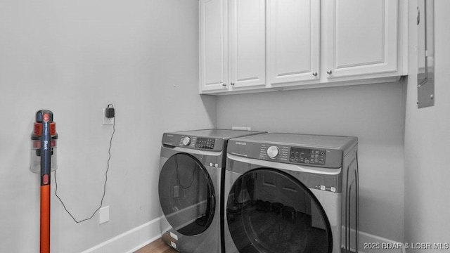 5450 Christopher Dr Unit 243, Osage Beach, MO 65065 - laundry area featuring washer and dryer and cabinet space