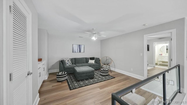 5450 Christopher Dr Unit 243, Osage Beach, MO 65065 - living room with a ceiling fan and light wood-style floors