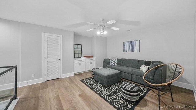 5450 Christopher Dr Unit 243, Osage Beach, MO 65065 - living room with ceiling fan and light wood finished floors