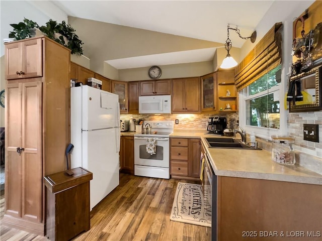 73 Good Neighbors Loop, Camdenton, MO 65020 - kitchen with white appliances, lofted ceiling, light wood finished floors, backsplash, and light countertops