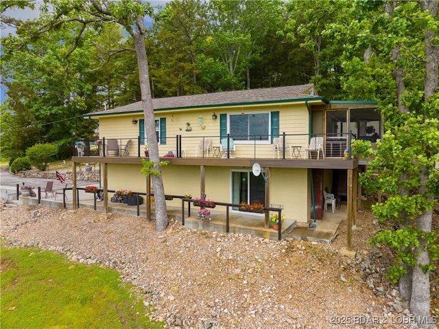 73 Good Neighbors Loop, Camdenton, MO 65020 - back of property featuring a patio area, a balcony, a shingled roof, and a wooden deck