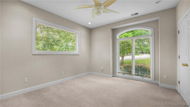 135 Greensboro Ct, Four Seasons, MO 65049 - empty room featuring a ceiling fan, carpet floors, and plenty of natural light