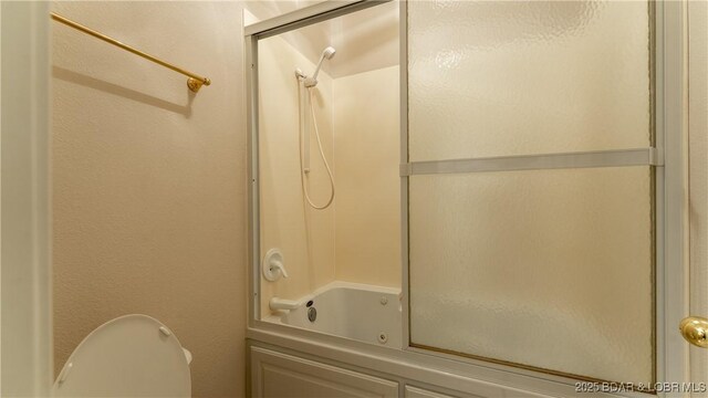 135 Greensboro Ct, Four Seasons, MO 65049 - bathroom featuring a combined bath / shower with jetted tub and toilet