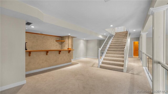 135 Greensboro Ct, Four Seasons, MO 65049 - finished basement with light carpet, stairway, recessed lighting, and bar