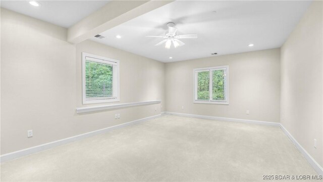 135 Greensboro Ct, Four Seasons, MO 65049 - unfurnished room featuring plenty of natural light, light colored carpet, ceiling fan, and recessed lighting