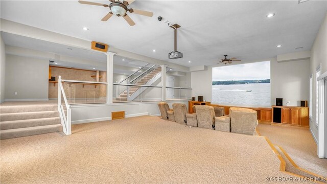 135 Greensboro Ct, Four Seasons, MO 65049 - dining area with a ceiling fan, light carpet, recessed lighting, stairway, and a water view