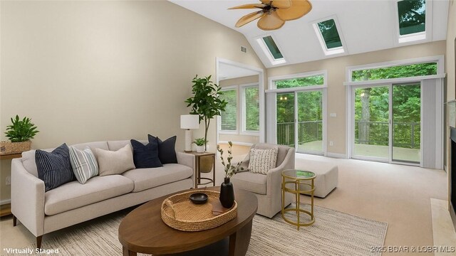 135 Greensboro Ct, Four Seasons, MO 65049 - living area with a skylight, lofted ceiling, carpet flooring, and ceiling fan