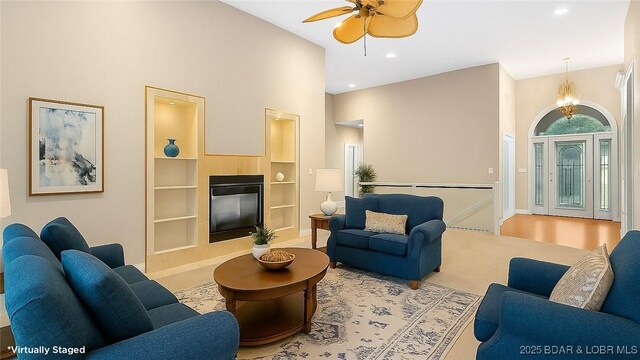 135 Greensboro Ct, Four Seasons, MO 65049 - living room featuring built in shelves, a high ceiling, a ceiling fan, and recessed lighting