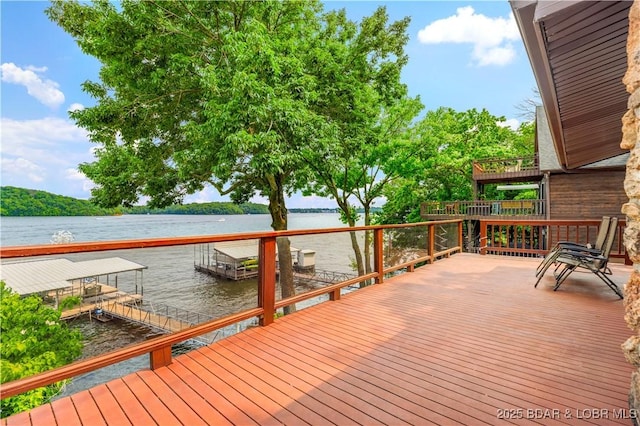 30383 Bullock Dr, Gravois Mills, MO 65037 - deck featuring a water view and a boat dock