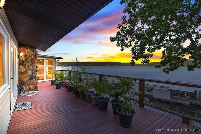 30383 Bullock Dr, Gravois Mills, MO 65037 - deck at dusk featuring a water view