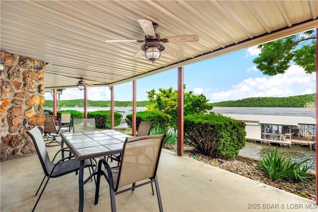 30383 Bullock Dr, Gravois Mills, MO 65037 - view of patio featuring ceiling fan, outdoor dining space, and a water view