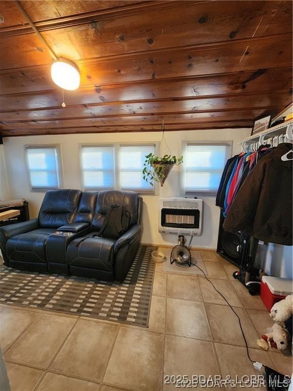 206 Oak St S, Versailles, MO 65084 - tiled living area featuring heating unit, wood ceiling, and healthy amount of natural light