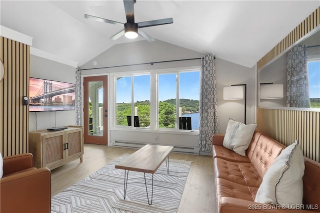 26794 Boone Rd, Barnett, MO 65011 - living area featuring vaulted ceiling, a baseboard radiator, a ceiling fan, and wood finished floors