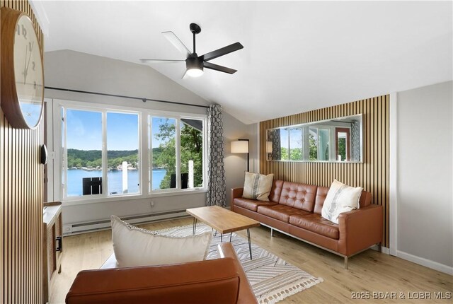 26794 Boone Rd, Barnett, MO 65011 - living area with baseboard heating, vaulted ceiling, ceiling fan, light wood-style flooring, and a water view