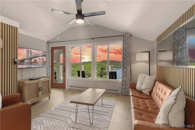26794 Boone Rd, Barnett, MO 65011 - living room with lofted ceiling, a ceiling fan, a baseboard radiator, and wood finished floors