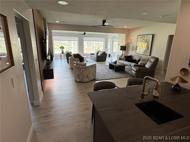 339 Cordoba Pt Unit 13B, Porto Cima, MO 65079 - living room featuring wood finished floors, ceiling fan, and recessed lighting