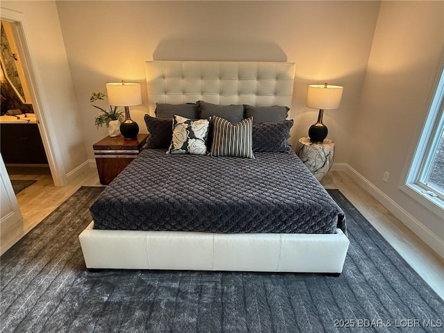 339 Cordoba Pt Unit 13B, Porto Cima, MO 65079 - bedroom featuring baseboards and wood finished floors