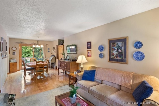 28 Wood River Rd, Lake Ozark, MO 65049 - carpeted living room featuring a chandelier, a textured ceiling, and wood finished floors