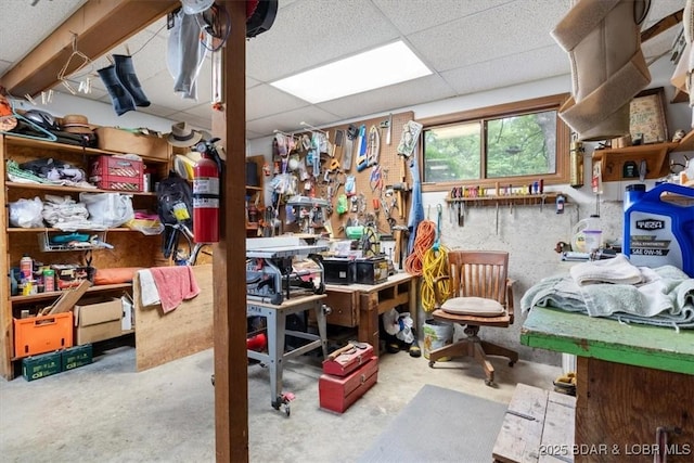 28 Wood River Rd, Lake Ozark, MO 65049 - misc room with a workshop area, a paneled ceiling, and unfinished concrete flooring