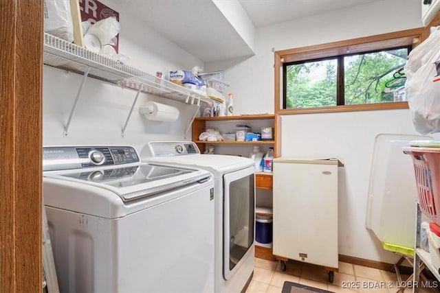 28 Wood River Rd, Lake Ozark, MO 65049 - laundry area with washer and clothes dryer and light tile patterned floors