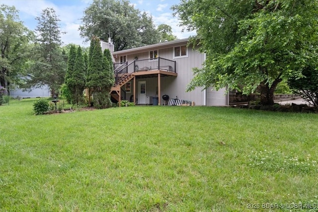 28 Wood River Rd, Lake Ozark, MO 65049 - rear view of property featuring a deck, a yard, stairs, and a chimney