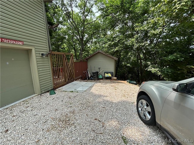 121 Banner St, Camdenton, MO 65020 - view of home's exterior with a gate and a garage