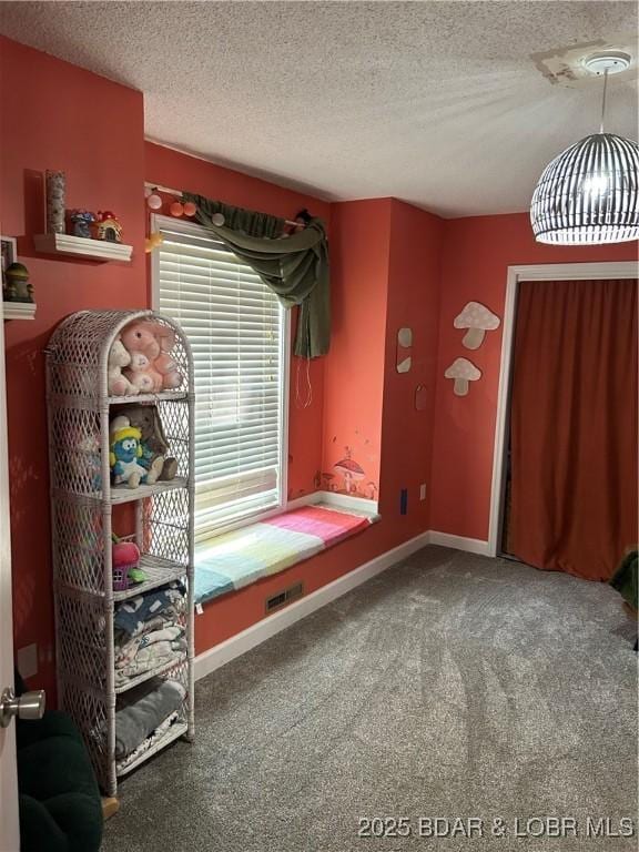 121 Banner St, Camdenton, MO 65020 - carpeted bedroom featuring a textured ceiling and baseboards