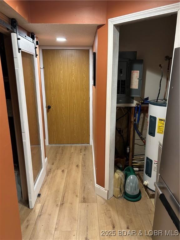 121 Banner St, Camdenton, MO 65020 - utility room featuring electric water heater and electric panel