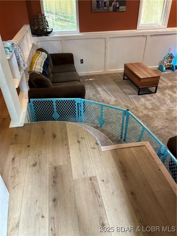 121 Banner St, Camdenton, MO 65020 - living area with a decorative wall, carpet, and wainscoting