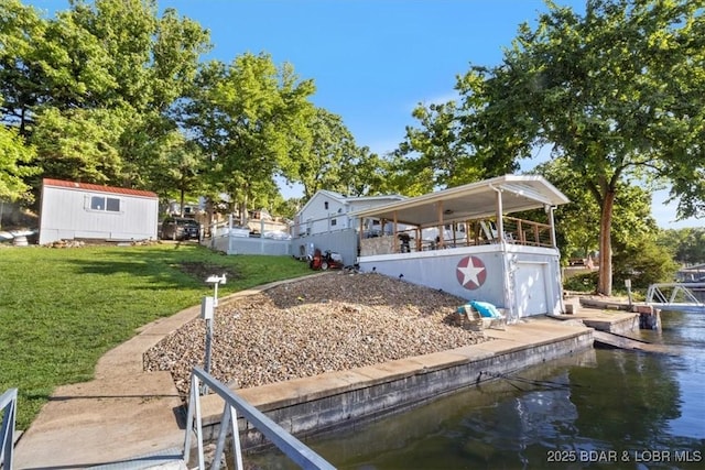 27638 Golden Point Ln, Barnett, MO 65011 - back of property featuring a water view, a yard, and a garage