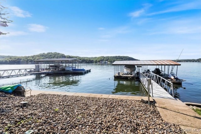 27638 Golden Point Ln, Barnett, MO 65011 - dock area featuring boat lift and a water view