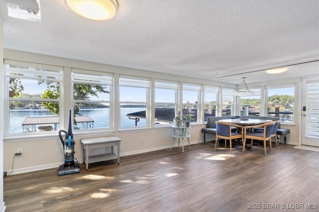 27638 Golden Point Ln, Barnett, MO 65011 - sunroom / solarium featuring a textured ceiling, wood finished floors, and a water view