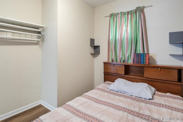 27638 Golden Point Ln, Barnett, MO 65011 - bedroom featuring wood finished floors and baseboards