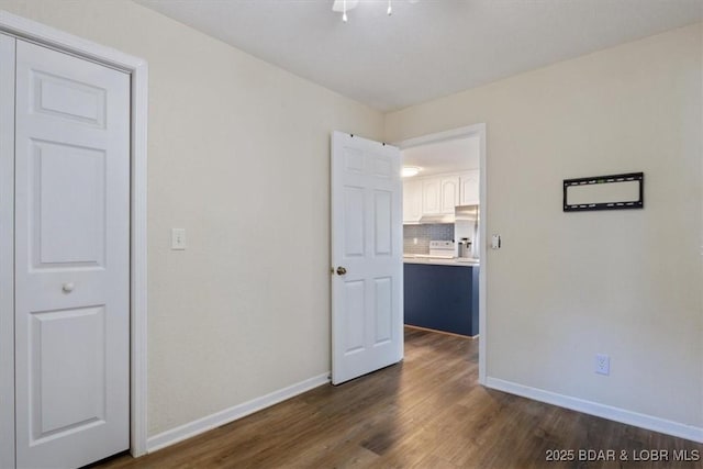 27638 Golden Point Ln, Barnett, MO 65011 - spare room with dark wood-style floors and baseboards