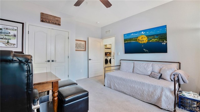 183 Upper Monarch Cove Dr Unit 3D, Lake Ozark, MO 65049 - carpeted living area featuring washing machine and clothes dryer and ceiling fan
