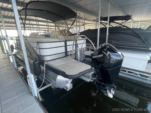 183 Upper Monarch Cove Dr Unit 3D, Lake Ozark, MO 65049 - dock area with boat lift