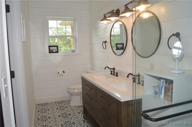 21 Winston Ln, Kaiser, MO 65047 - bathroom featuring double vanity and toilet