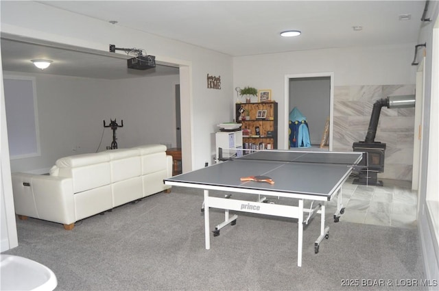 21 Winston Ln, Kaiser, MO 65047 - recreation room featuring a wood stove and carpet
