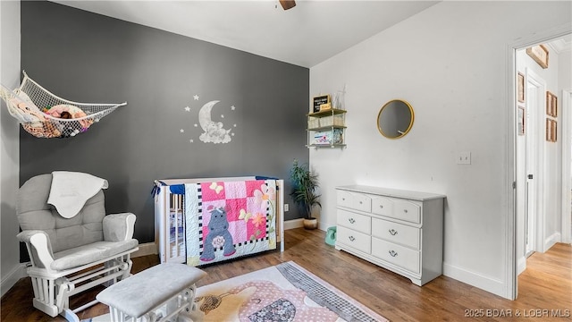 21 Winston Ln, Kaiser, MO 65047 - bedroom featuring wood finished floors and baseboards