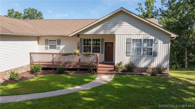 21 Winston Ln, Kaiser, MO 65047 - view of front of house featuring a front lawn, board and batten siding, and a shingled roof